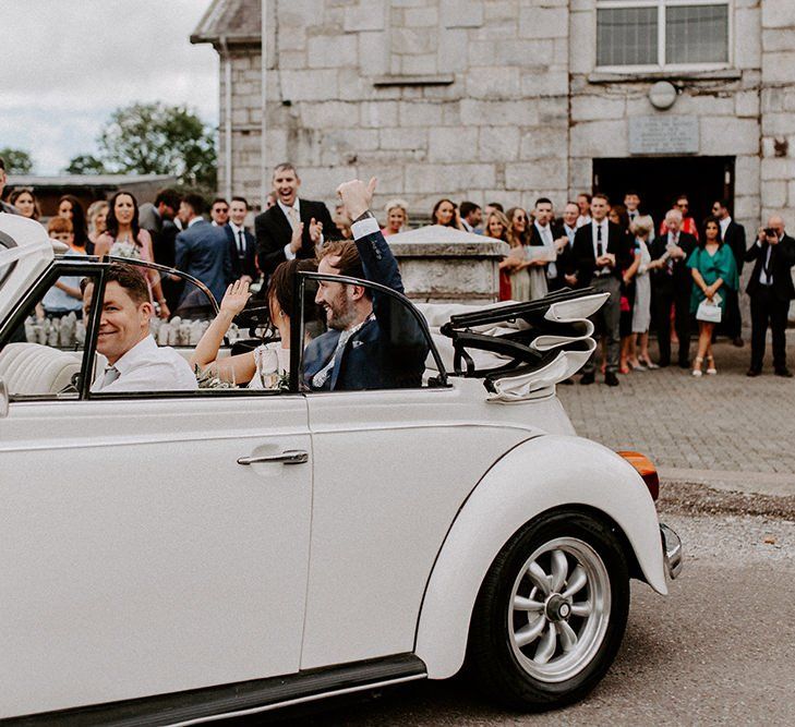 White wedding car for rustic Summer wedding