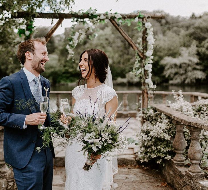 Bride in Jesus Peiro wedding dress with groom in blue wedding suit