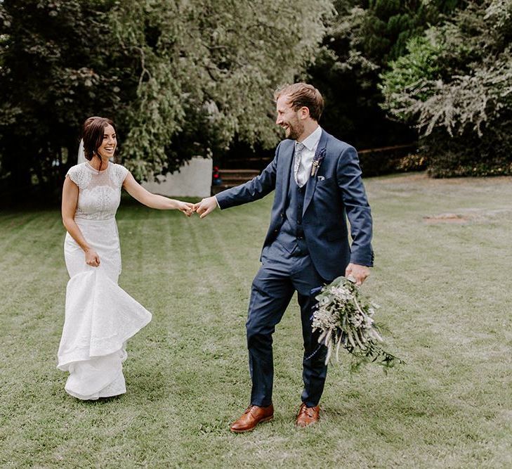 Bride wearing Jesus Peiro wedding dress with mermaid silhouette