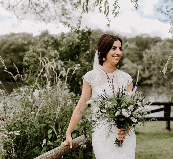 Bridal undo with wild flower bouquet and Jesus Peiro wedding dress