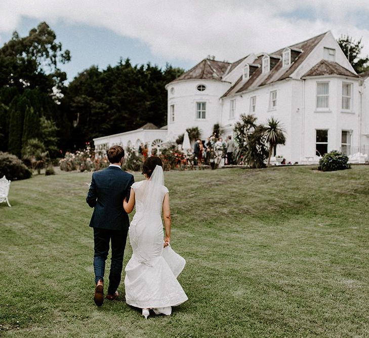 Jesus Peiro wedding dress for bride with groom at Innishannon House