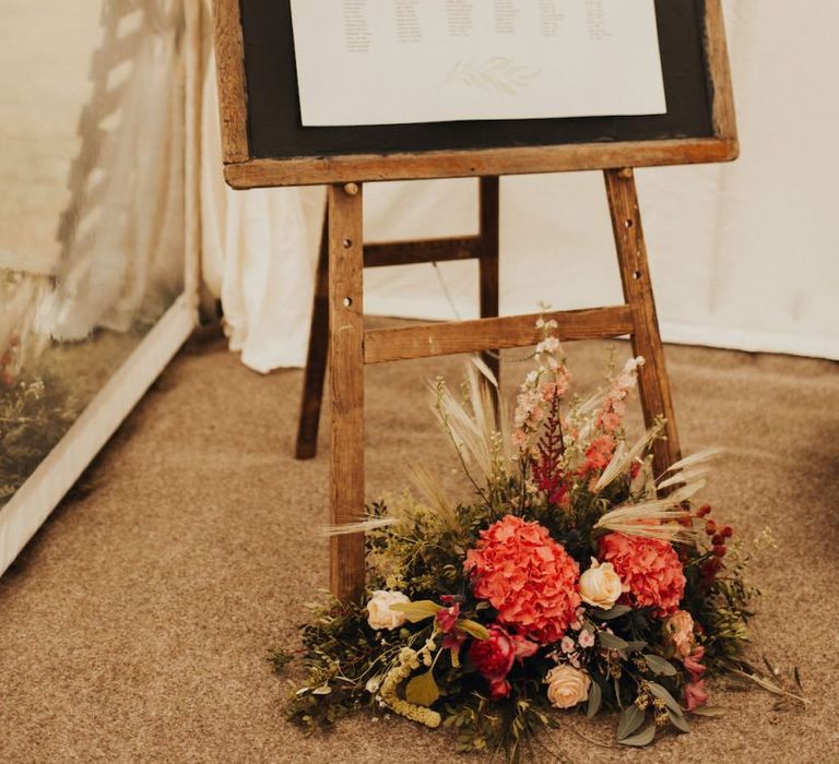 Wedding seating chart with floral decor