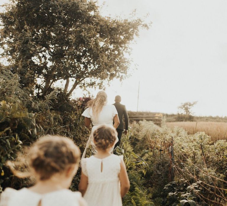 Family walking through Dartmoor Field wedding venue