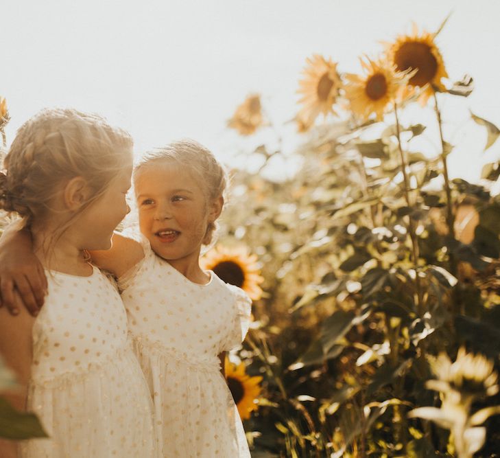 Flower girl portrait in sunflower field