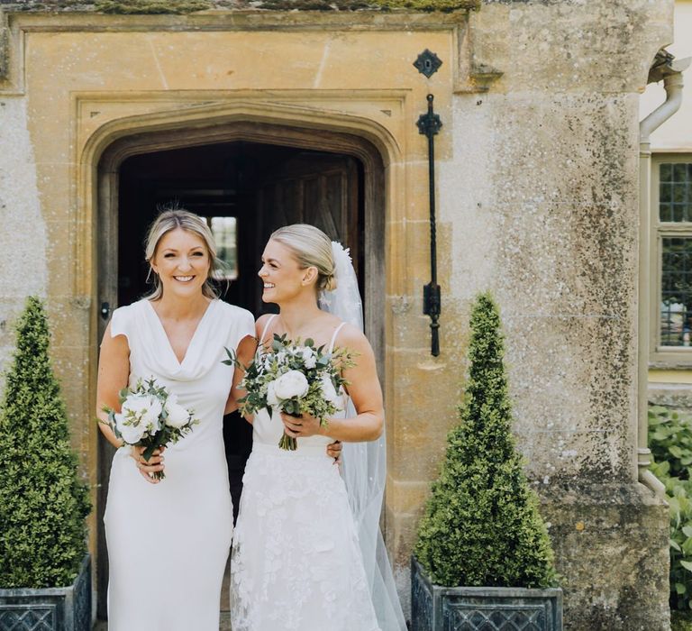 Bridesmaid in Ghost London White Satin Dress with White Wedding Flowers at Family Home