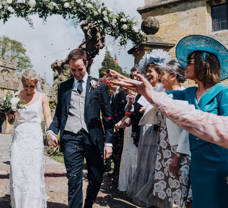 Church Wedding Confetti Shot with Bride in Two Piece Wedding Gown