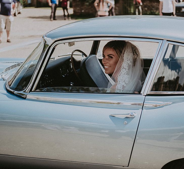 Bride Arriving to the Church in a Blue  E-Type Jaguar Wedding Car