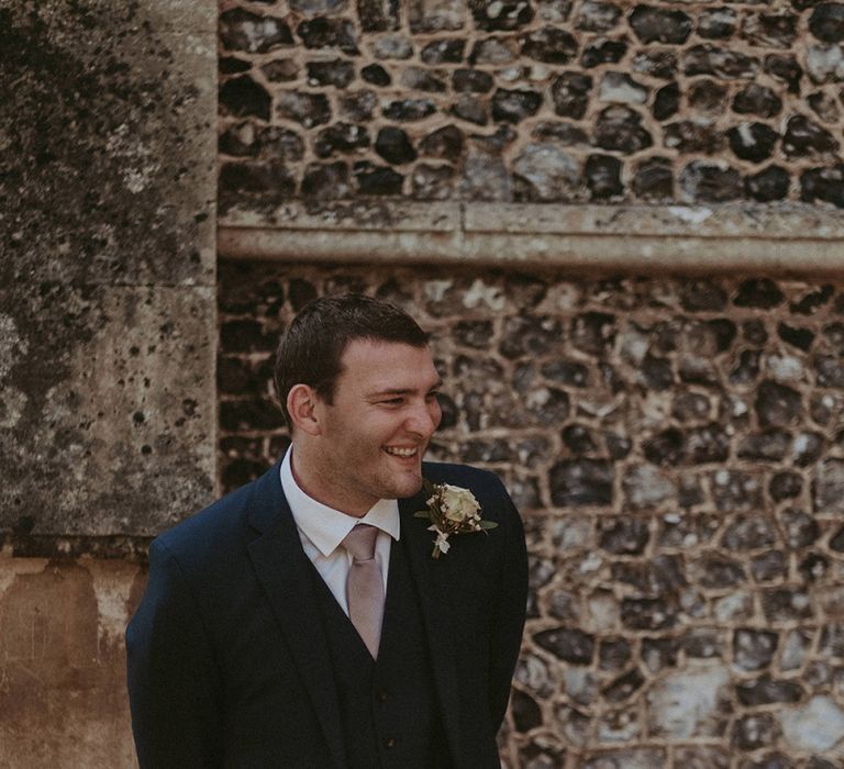 Happy Groom in Navy Blue Wedding Suit