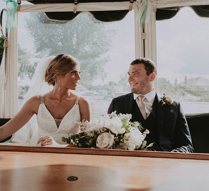 Bride and Groom Enjoying a River Side Cruise