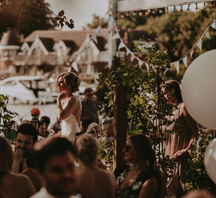 Bride During Wedding Reception with Bunting Decor