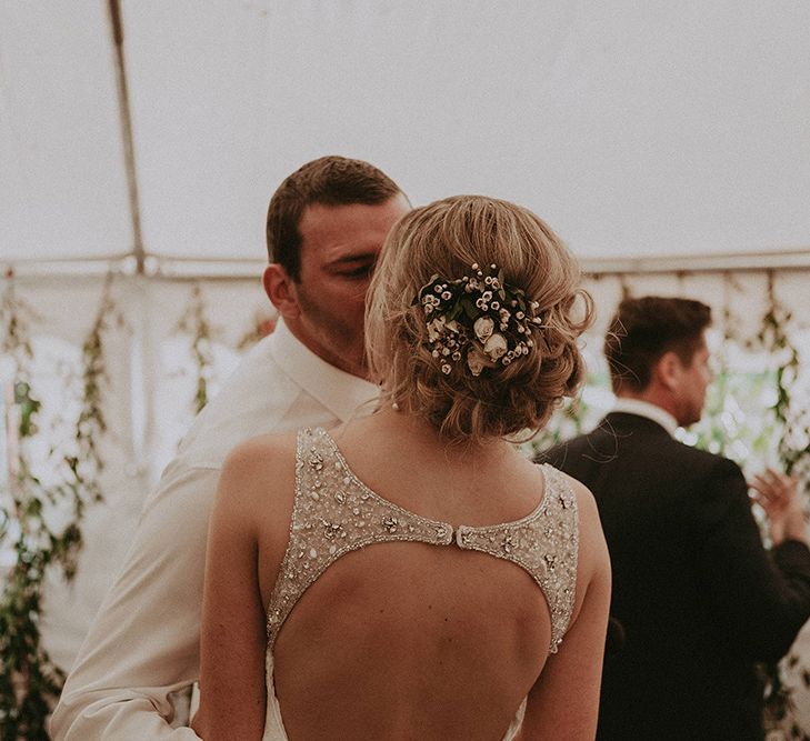 Pinned Back Bridal Up Do with Fresh Flower Decor