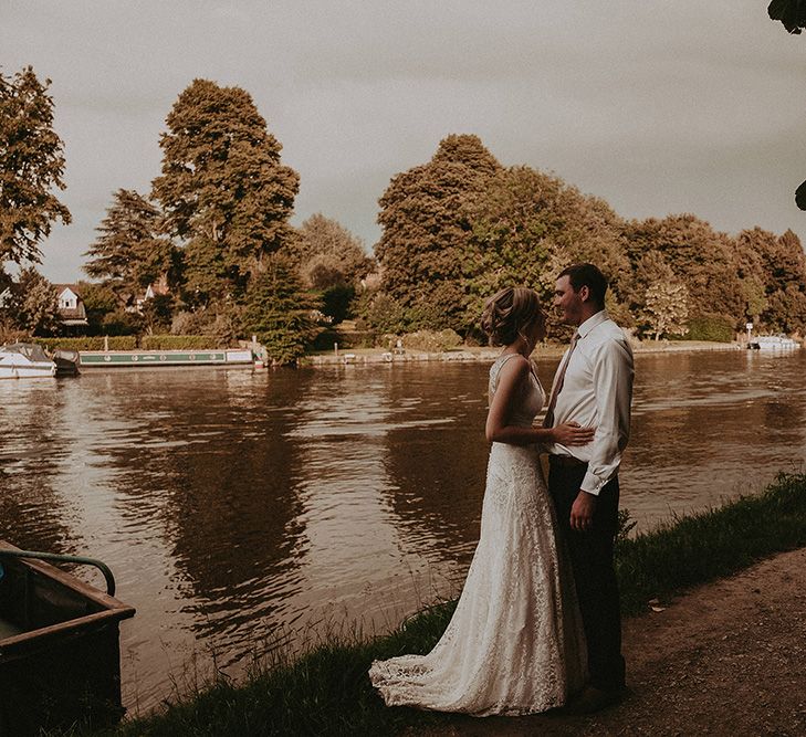 Bride and Groom Portrait By The River Bank