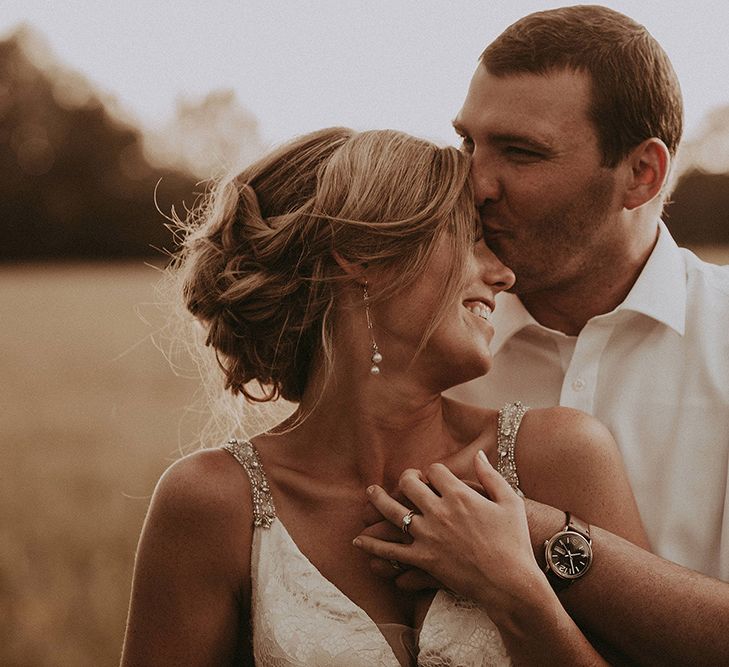 Groom Kissing The Brides Forehead