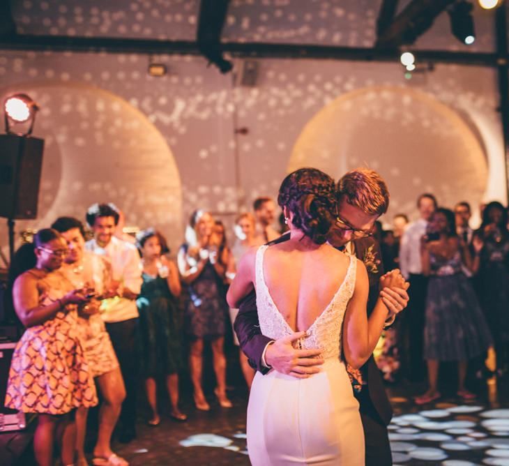 Bride and grooms first dance with fairy light backdrop