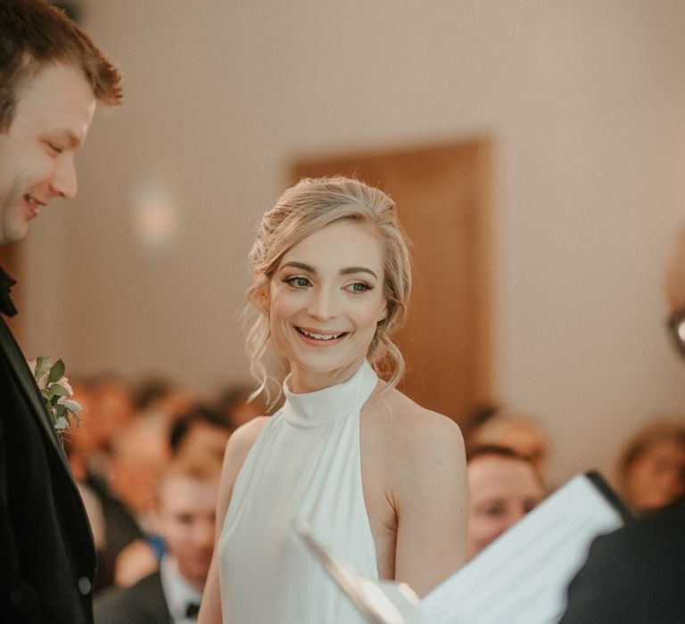 Bridal Beauty During Ceremony In Halterneck Bride Dress