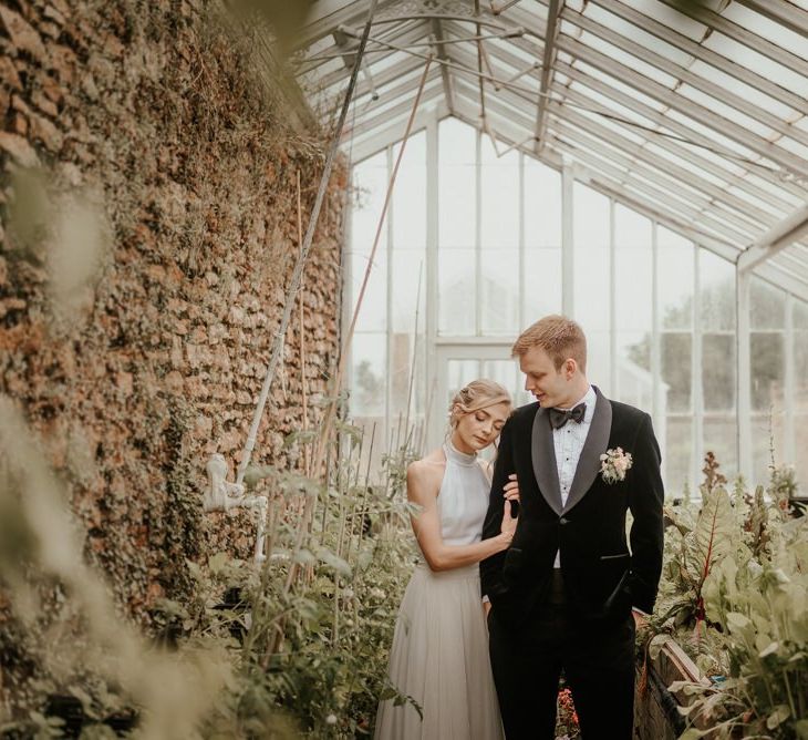 Bride and Groom In Coombe Lodge Greenhouse