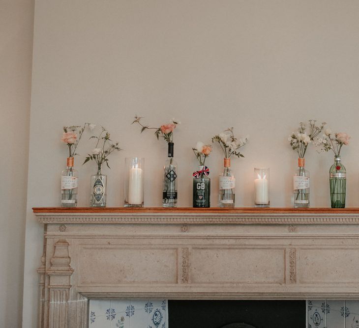 Wedding Flower Stems In Individual Glass Jars With Candles