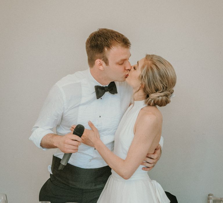 Bride and Groom Embrace During Speeches with Bride In Stella McCartney Wedding Dress