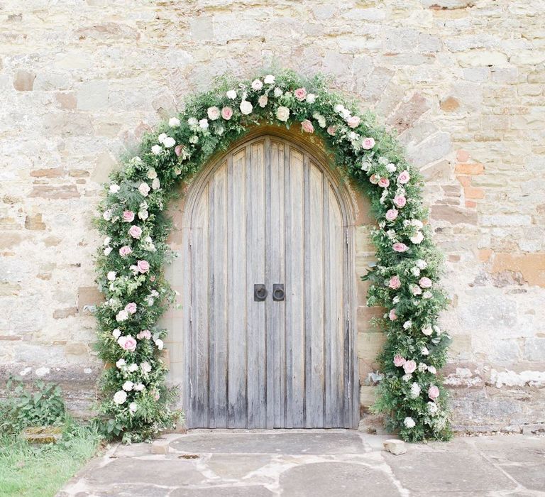 Pink rose church floral arch wedding flowers