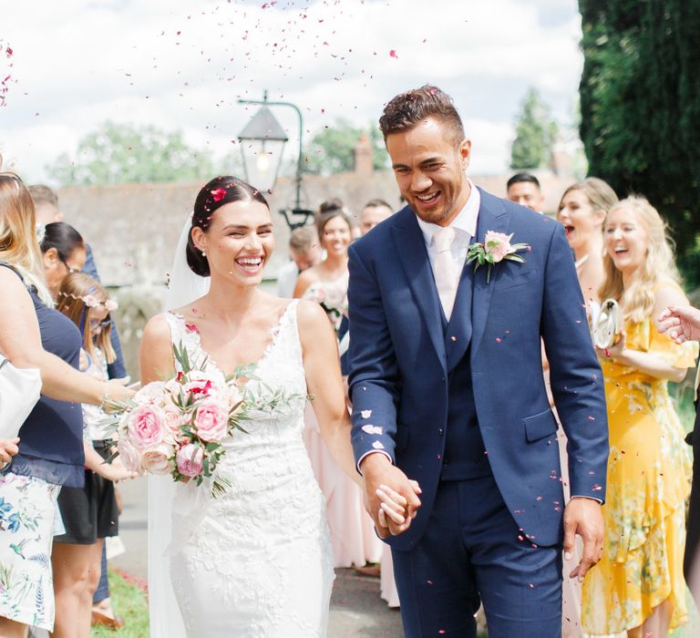 Bride and groom confetti moment by White Stag Wedding Photography