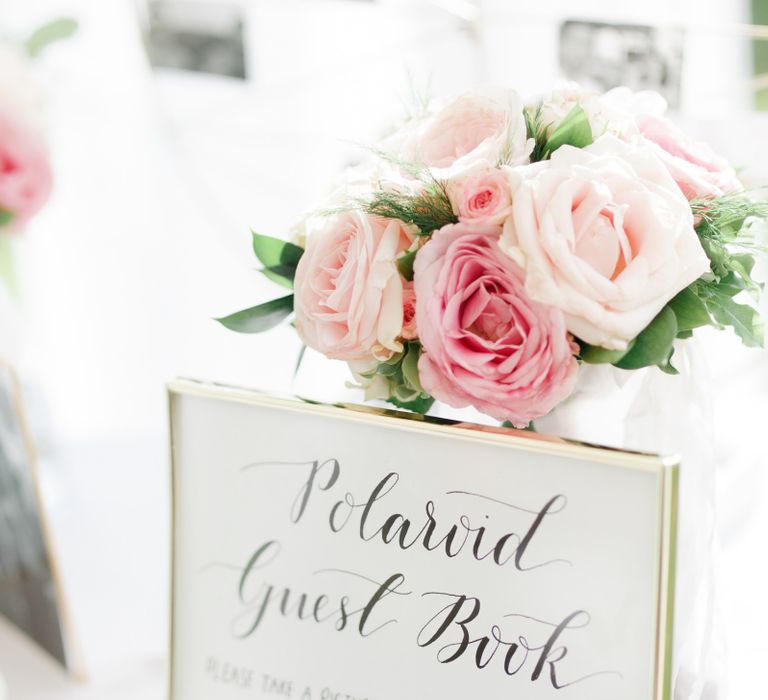 Polaroid guest book wedding sign in gold frame