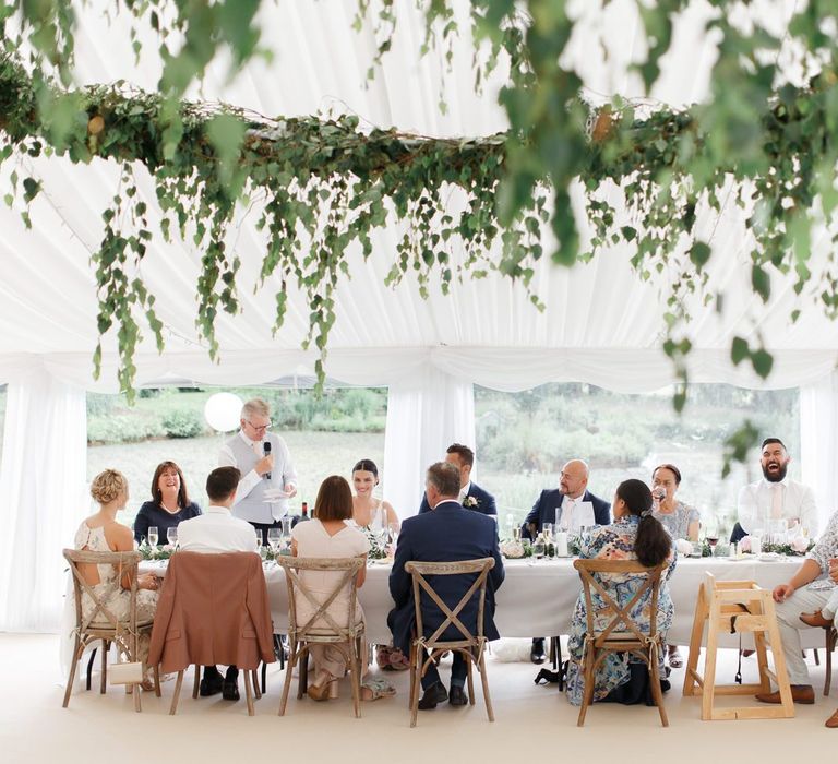 Wedding guests at Coddington Vineyard marquee reception