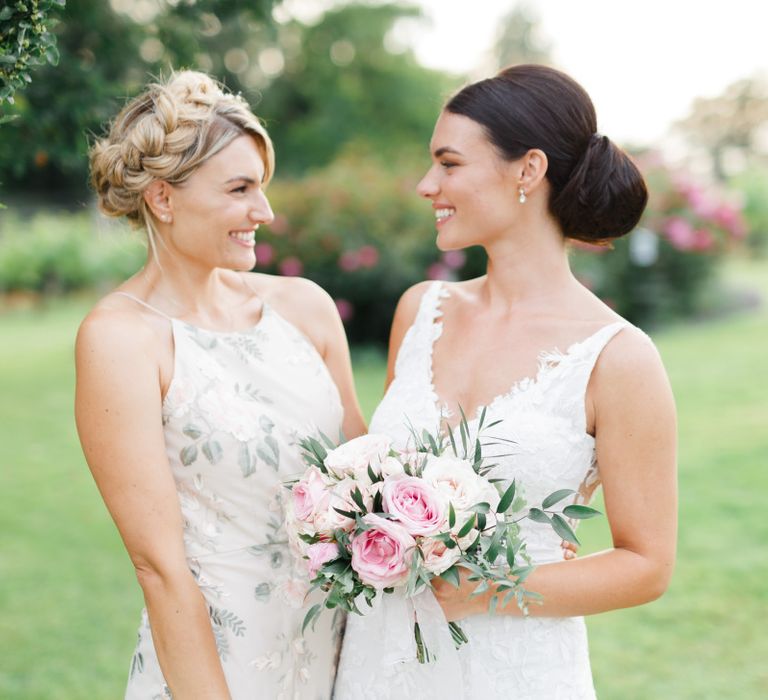 Bride and her Maid of Honour in floral dress