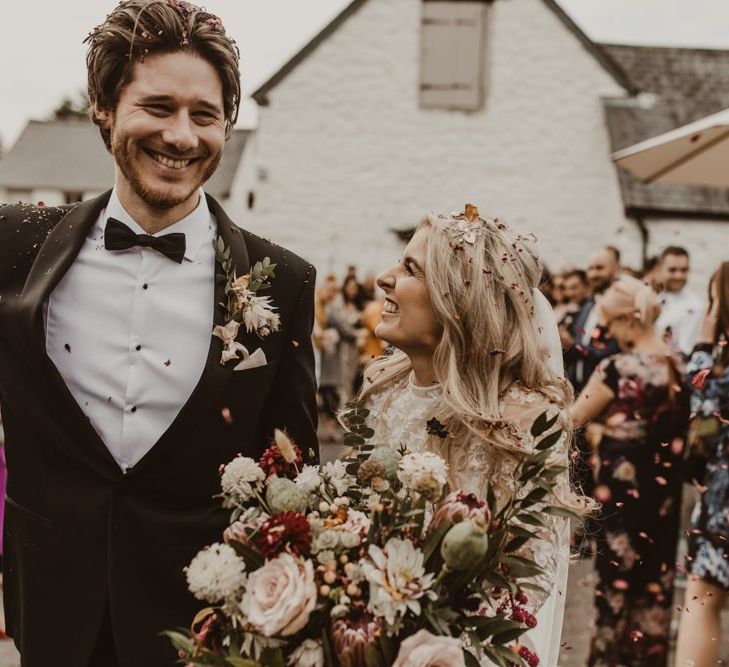 Confetti moment for bride and groom