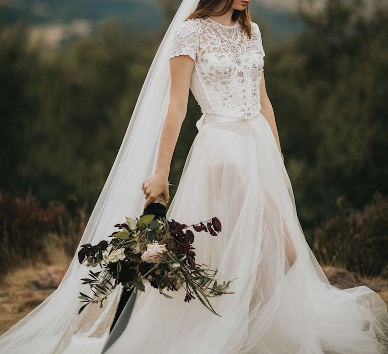 Burgundy Floral Bouquet &amp; Ribbon by Quintessential Wild Florist | Bride in Gown from Frances Day Bridal with Front Split | Romantic, Bohemian Elopement in the Peaks by Natalie Hewitt Wedding Planner | Henry Lowther Photography