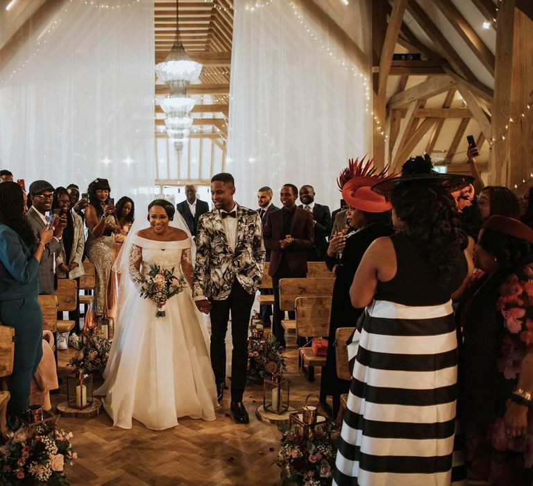 Wedding ceremony bridal entrance at The Old Kent Barn wedding venue