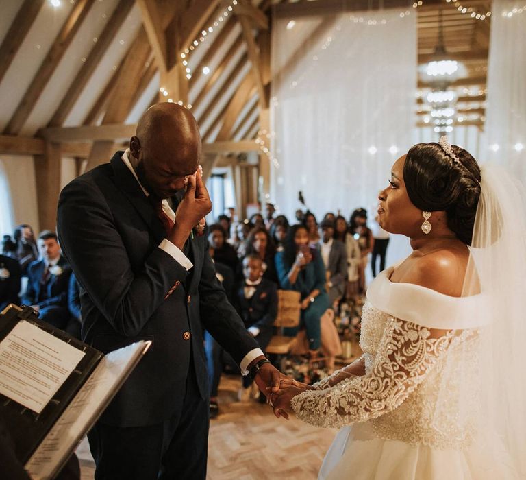 Emotional wedding ceremony at The Old Kent Barn wedding venue