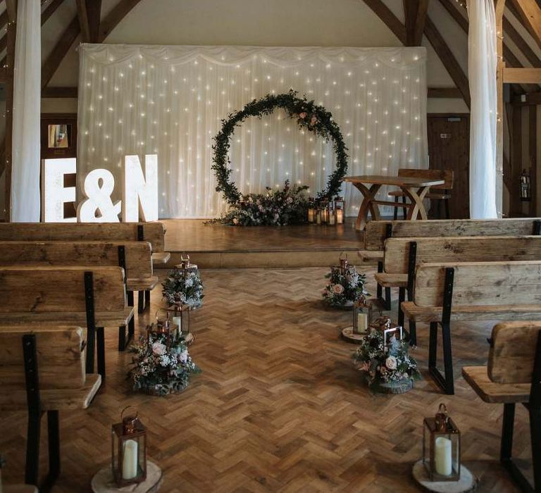 Aisle and altar wedding decor at The Old Kent Barn wedding venue