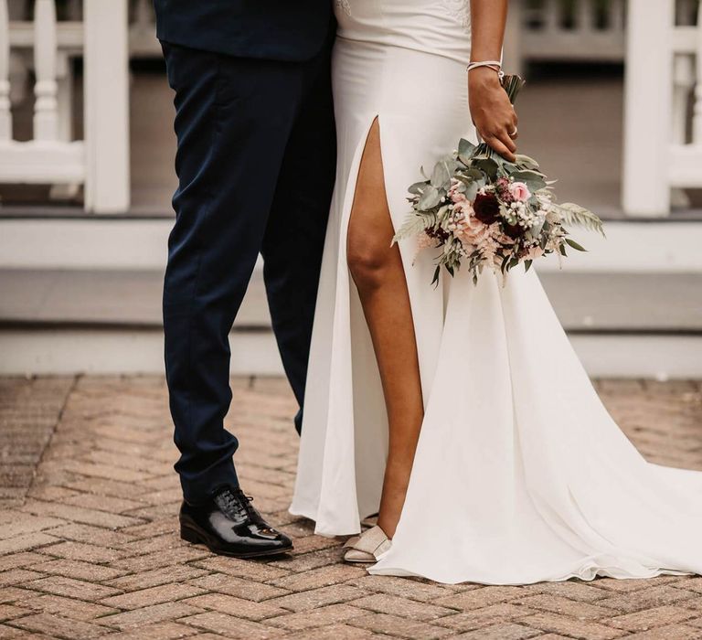 Bride in wedding dress with front split