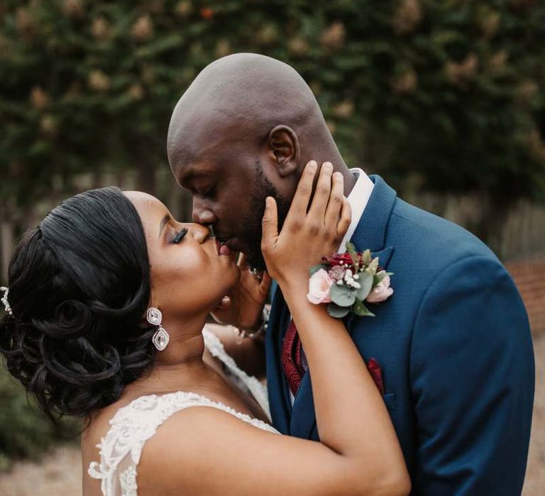 Portrait of bride and groom kissing by Olegs Samsonovs Photography