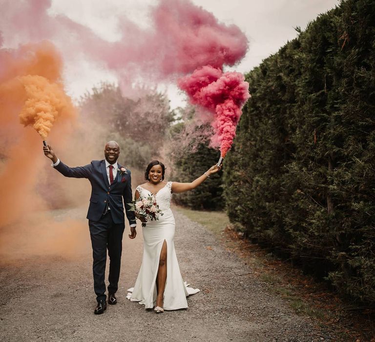 Bride and groom smoke bomb portraits at The Old Kent barn