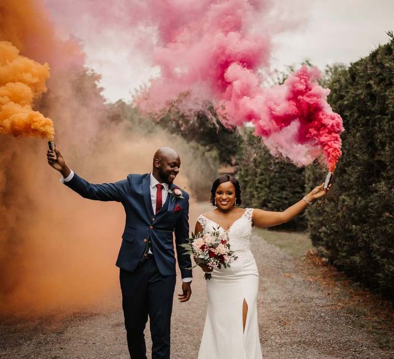 Bride and groom smoke bomb portrait by Olegs Samsonovs