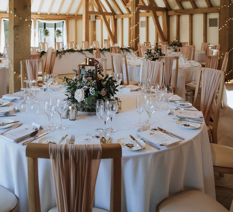 Round tables at The Old Kent Barn wedding reception