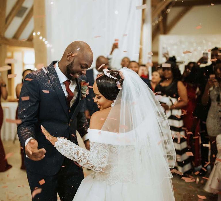 Bride and groom dancing at The Old Kent Barn wedding venue