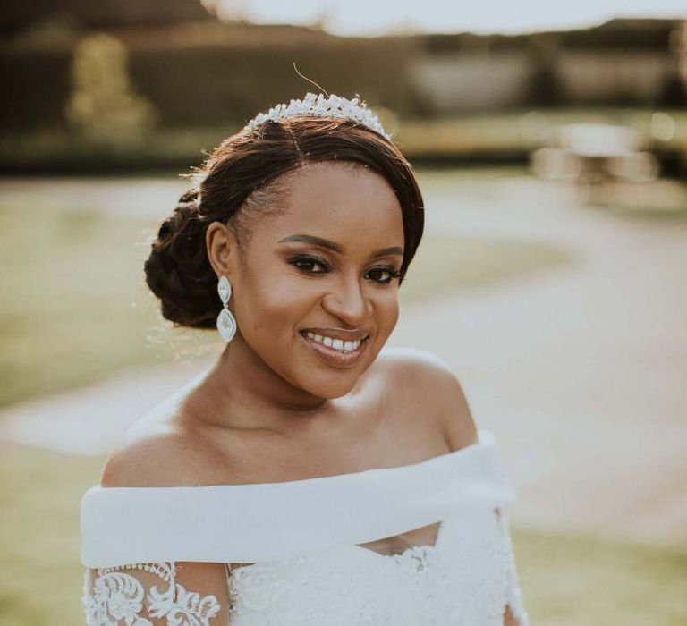 Beautiful black bride in off the shoulder wedding dress with long sleeves and full skirt  for The Old Kent Barn wedding