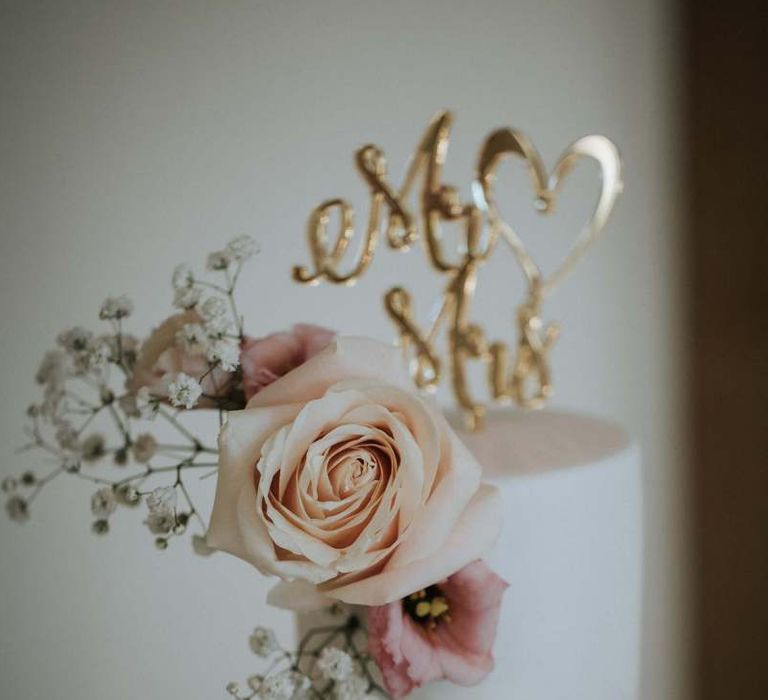 Gold cake topper and floral decor