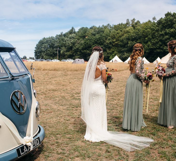 Bride in Lenora Dress by Wtoo Watters with Lace Cap Sleeves and Keyhole Back | Bridesmaids in Dusky Green Needle &amp; Thread Dresses with Floral Embroidered Bodice and Long Sleeves | Colourful Wedding Bouquets with Sunflowers and Yellow Trailing Ribbons | Vintage VW Campervan | Macrame Decor, Vintage Caravan Photobooth and Five-Tier Naked Wedding Cake for Boho Wedding in Woodlands | Freckle Photography