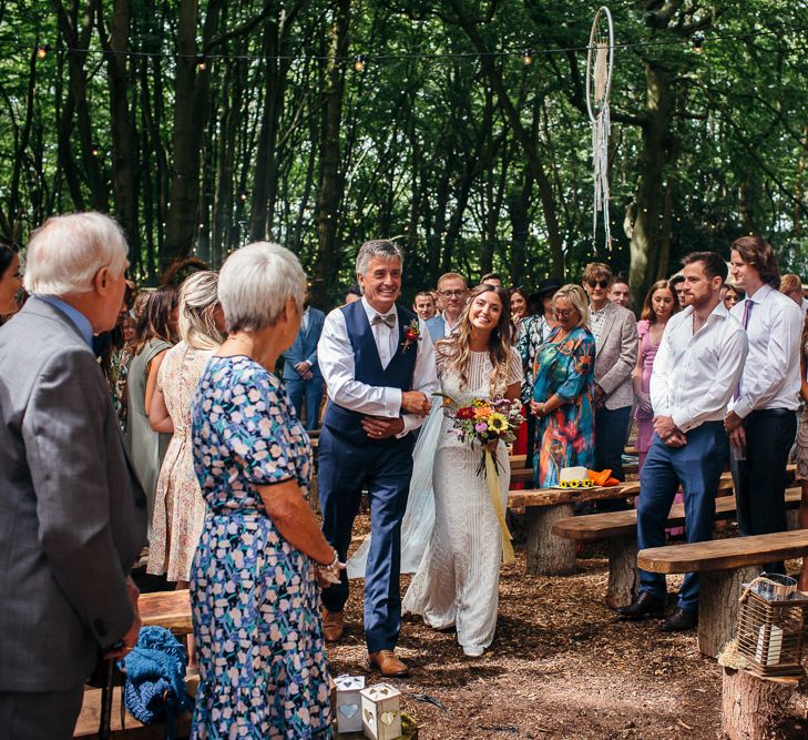 Bride in Lenora Dress by Wtoo Watters with Lace Cap Sleeves and Keyhole Back | Father of the Bride in Blue Waistcoat, Trousers and Bow Tie | Colourful Bridal Bouquet with Sunflowers and Yellow Trailing Ribbon | Woodland Wedding Ceremony at Lila's Wood | Macrame Decor, Vintage Caravan Photobooth and Five-Tier Naked Wedding Cake for Boho Wedding in Woodlands | Freckle Photography