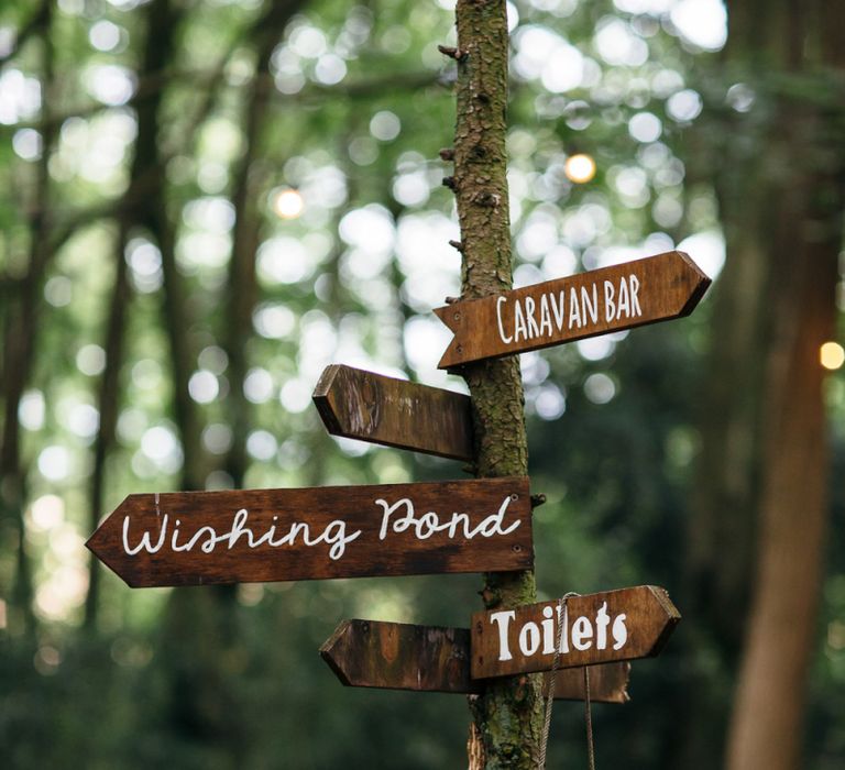 Wooden Wedding Sign | Macrame Decor, Vintage Caravan Photobooth and Five-Tier Naked Wedding Cake for Boho Wedding in Woodlands | Freckle Photography