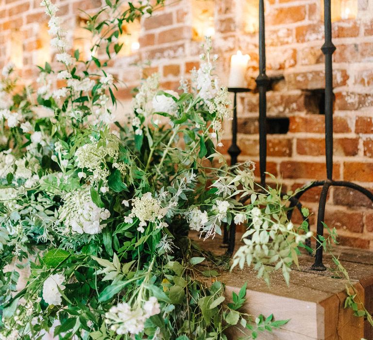 Hazel Gap Barn | Wedding Ceremony | Decor | Large White and Green Floral Display | Candles | Hazel Gap Barn Wedding with Bride Arriving by Kit Car | Sarah-Jane Ethan Photography