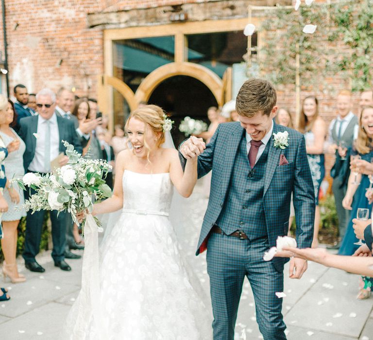 Confetti Moment | Just Married | Bride in Strapless Sassi Holford Ballgown Wedding Dress with Belt | Groom in Blue Check Paul Smith Suit | Hazel Gap Barn Wedding with Bride Arriving by Kit Car | Sarah-Jane Ethan Photography