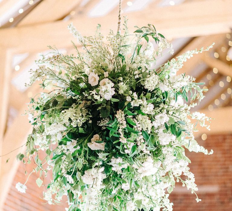 Wedding Reception Decor | Floral Ceiling Display | White Flowers and Green Foliage |  Hazel Gap Barn Wedding with Bride Arriving by Kit Car | Sarah-Jane Ethan Photography