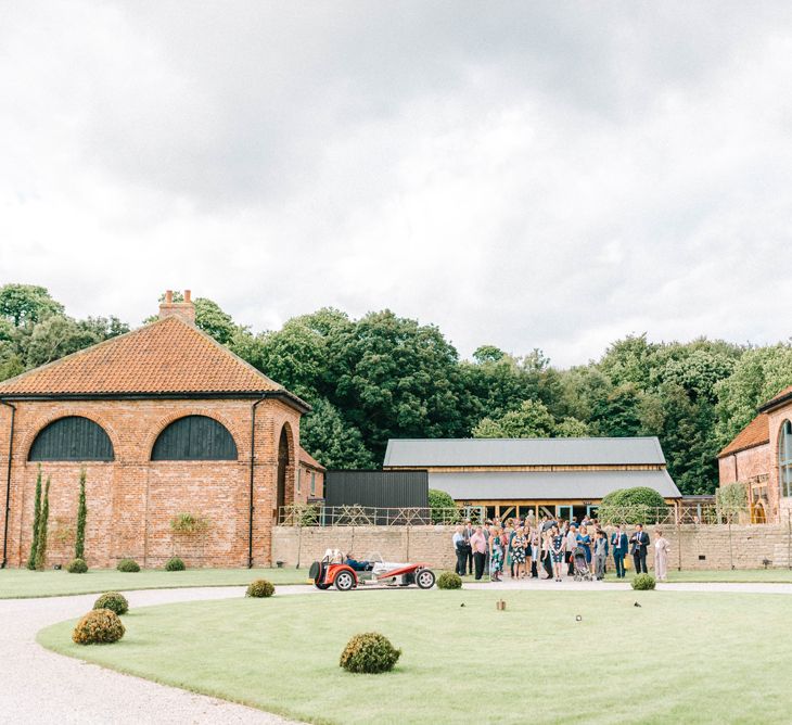 Hazel Gap Barn | Red Kit Car | Hazel Gap Barn Wedding with Bride Arriving by Kit Car | Sarah-Jane Ethan Photography