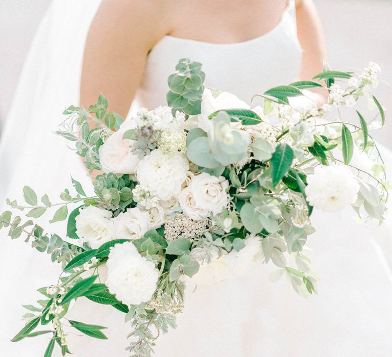 Bride in Strapless Sassi Holford Ballgown Wedding Dress with Belt | Loose Bouquet of White Flowers and Foliage | Hazel Gap Barn Wedding with Bride Arriving by Kit Car | Sarah-Jane Ethan Photography