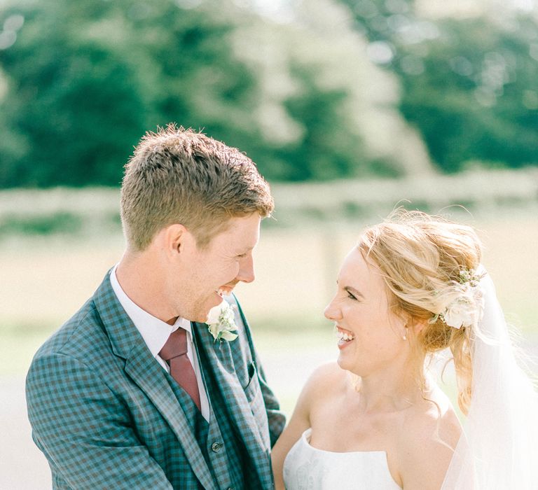 Bride in Strapless Sassi Holford Ballgown Wedding Dress with Belt | Groom in Blue Check Paul Smith Suit | Loose Bouquet of White Flowers and Foliage | Hazel Gap Barn Wedding with Bride Arriving by Kit Car | Sarah-Jane Ethan Photography