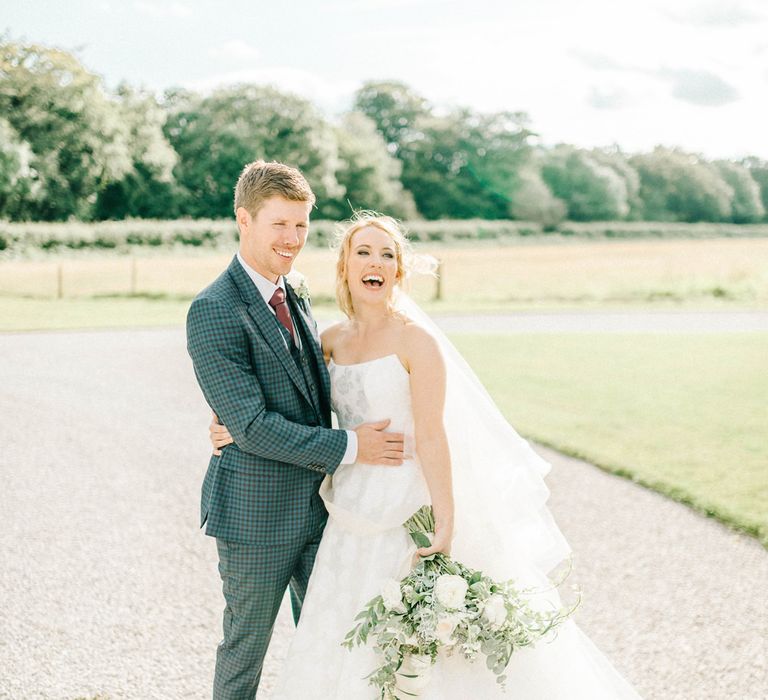 Bride in Strapless Sassi Holford Ballgown Wedding Dress with Belt | Groom in Blue Check Paul Smith Suit | Loose Bouquet of White Flowers and Foliage | Hazel Gap Barn Wedding with Bride Arriving by Kit Car | Sarah-Jane Ethan Photography